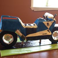 Motorcycle Cake I had so much trouble with this cake. It is all cake except the wheels. Chocolate cake, buttercream , and covered with MMF.