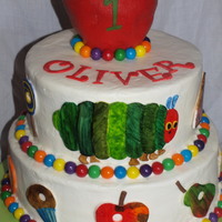 The Very Hungry Caterpillar And All Of His Treats Cake is BC with hand painted fondant decorations. The apple on top was the smash cake. Thanks for looking!