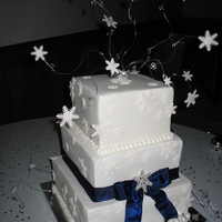 Snowflake Square Wedding Cake Inspired by a photo the bride had of another cake......fondant with gumpaste snowflakes