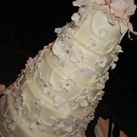 Dogwood 5 Tier Dogwood gumpaste flowers on fondant, fondant swirls, bronze shimmer on the flowers, pearl dust airbrushed on the whole thing