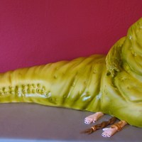 Jabba The Hut & Princess Jabba is cake & fondant, airbrushed. Princess is fondant.