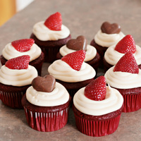 Valentine Cupcakes Red Velvet cake with BC topped with strawberries and Butterfinger heart shaped candy