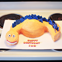 Dinosaur Birthday Cake Made with BC and Fondany spikes. I was very dissappointed in this cake cuz I should have just covered the whole thing in fondany but I made...