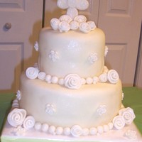 First Communion Round Tiered This is the first time I ever covered a cake in fondant or made flowers. Cake is covered in mmfondant, gumpaste/fondant mix cross, fondant...