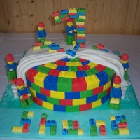 Lego Men At Work This was for my nephews 7th birthday. "7" made from gumpaste. Lego pattern on cake and lego men are fondant.