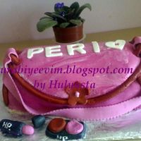 My First Purse Cake I finally did the purse cake.This was a birthday suprise for my niece Perinur.She is 20 now.I used the tutorials here on CC and thanks to...