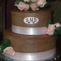 Wedding Cake Made this for my coworker's wedding reception. Bride wanted something simple for a party of 30 guests. Top tier is lemon with lemon...