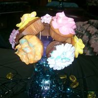 Vase Of Flower Cupcakes I made this for my sisters bithday. I know there is a gap but this is the best photo I could find. They looked georgous in person.
