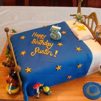 Toy Story Cake Cake is an 11"x15" triple layer sheet cake covered w/ fondant. Headboard and footboard are gum paste. Characters are store-bought...