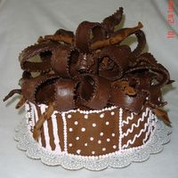 Chocolate_Bow__105.jpg This was for one of my best friend's 50th birthday ( she loves dark chocolate). Bow is MM fondant with dark chocolate and gum paste....