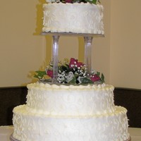 Random Vines And Roses One of my most popular cakes! Buttercream tiers are covered with a random vine design. The entire cake is supported by 4 inch pillars, with...