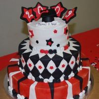 Michael's Graduation 14", 10", and 6" iced in BC w/ strawberry filling and fondant accents