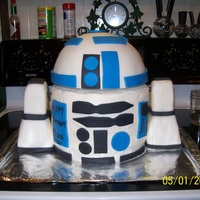 R2D2 I made this for my little Star Wars junkie. Head and legs are styrofoam covered in fondant. And four round cakes stacked up. It was a big...
