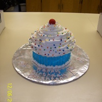 Giant Cupcake b/c frosting, with a giant fondant cherry rolled in red sugar.