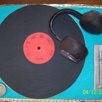 Hip Hop Cake I made this for my oldest daughter's 11th birthday. The record and dials are fondant. I made the headphones out of doughnuts and...