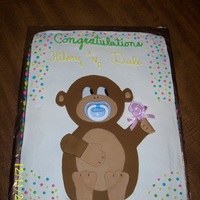 Monkey Baby Shower Cake The pacifier and rattle are plastic...b/c frosting, with fondant monkey