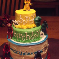 Superhero Lego Men Men and fist are gumpaste painted with vodka and luster dust. Cake is Yellow and buttercream frosting.