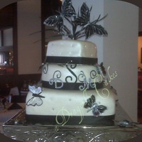 Butterfly Dream The butterflies are made of gelatin with pixie dust edges. Cake is English Toffee, Vanilla Almond and Carrot cake. All covered in MMF,...