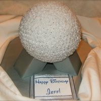 Spaceship Earth Epcot Cake This was a last minute cake, so it's a little plain. I made it using the Wilton Sports Ball pan, and my husband constructed the legs...