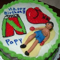 Boxing Mexican Guy I made this cake for mi mom's husbands birthday,he likes boxing , buttercream covered,boxer made of fondant...HE WAS MY FIRST PERSON...