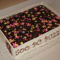 Jigsaw Puzzle Cake For a friend who is crazy about jigsaw puzzles. Chocolate cake with chocolate buttercream, sides are fondant and puzzle pieces are cut from...