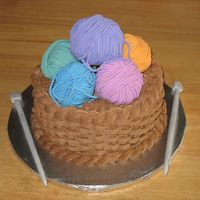 Basket Of Yarn For a lady who knits. Marble cake with chocolate buttercream. The yarn balls are fondant-covered cupcakes. Knitting needles are gumpaste-...