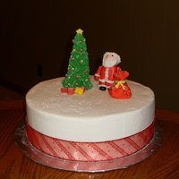 Santa buttercream/ fondant accents. my first santa with fondant. he does have a hat on you just can't see it in this picture.