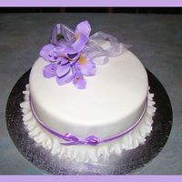 Iris's Fruit cake covered in Fondant with fondant Garrett Frill and modeling fondant Iris's