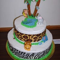 Jungle/safari palm tree is made out of pretzel, fondant leaves cut outs big animals are plastic, smaller animals are mini digital E.I. plaques (alligator...