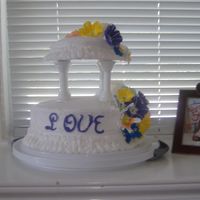 Tropical Love This was my graduation cake for my cake classes. It was a 10in and 6 in pineapple w/ pineapple filling iced in buttercream. The flowers are...