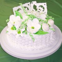 English Garden I made ths cake for a Mother's day Luncheon at my church. Its a 9 inch butter cake with buttercream frosting. The flowers are made of...