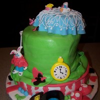 Alice In Wonderland This was a super hard cake for me....the layers are lemon,Strawberry and chocolate covered in fondant...this was my first attemt at molding...