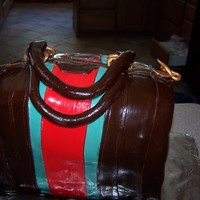 Guchi red velvet with cream cheese frosting and chocolate fondant