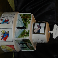 Runner & Comics This was for a dual birthday. The wife is an avid runner and the middle tier has handpainted scenes from Central Park, the lower tier is...