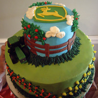 John Deere John Deere cake inspired by the beautiful cake of Jaklotz1. All buttercream except fence, tree trunks and John Deere plaque, which were...
