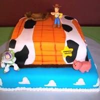 Toy Story Cakes covered in colored fondant. Hat, pig and edge-a-sketch also done in fondant