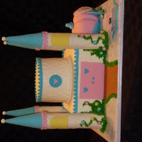 Castle Cake BC with fondant accents. Turrets and carriage made out of rice krisipie treats covered in fondant. TFL.
