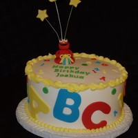 Elmo Birthday Cake BC with fondant accents. Elmo is made out of fondant/gumpaste. Design of this cake was borrowed from all the beautiful Elmo cakes on CC....