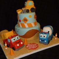 Construction Themed Birthday Cake All fondant. Trucks are made from rice krispie treats. Borrowed idea of trucks from someone on CC, thanks for the inspiration. TFL.