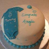Baby Shower I made this for my cousin's baby shower. She's having a boy! Cake covered in MMF, MMF onesie and BC rattle. I added little baby...