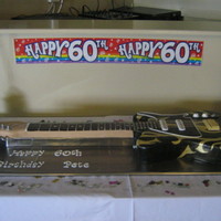 Electric Guitar Cake The main body of the guitar was made of vanilla sponge cake with vanilla b/c and raspberry jam filling and the neck was made from RCT, all...