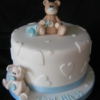 Baptism Cake 7" vanilla sponge top cake with vanilla b/c and raspberry jam. Covered in fondant with gumpaste accents.This was displayed with...