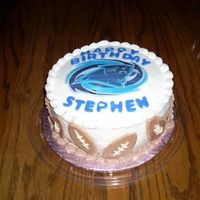 Carolina Panthers Marble Cake with Buttercream Icing. Panthers logo was color flow. Fondant footballs around sides. Made for a nephews 17th birthday.