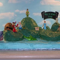 Peter Pan Neverland Cake This cake is my version of Neverland. I made it for my son's 1st birthday party. It is spice cake with cream cheese buttercream...
