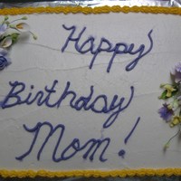 Zella's Birthday Cake Buttercream icing with gumpaste flowers.