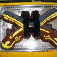Military Police Cross Pistol Cake I made this cake for my husband's change of command. He's a captain so I put his bars in the middle. I carved it all by sight...