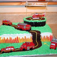 Fire Trucks The mom wanted me to use all these firetrucks and helicopter, I think it turned out cute.