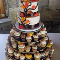 2 Tier Autumn Cutting Cake & Assorted Cupcakes Cake design inspired by Pink Cake Box6" & 8" rounds with assorted regular and mini cupcakes.