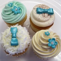Turquoise Wedding Cupcakes Flavors include:TiramisuPistachioFluffer NutterCoconut Cream PieBows & flowers are gumpaste