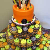 Halloween Cupcake Tower & Cake This was our donation to a fundraiser for the Albuquerque Rescue Mission.6" cake and 12 dozen mini cupcakes